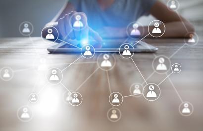 Image by Wright Studio via Shutterstock. White pictogram of people connecting to a tablet. Image by Wright Studio via Shutterstock.