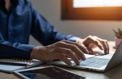 Image by Thanadon88 via Shutterstock. Man is filling the IHI call applicant form to get funding on Heath Research.